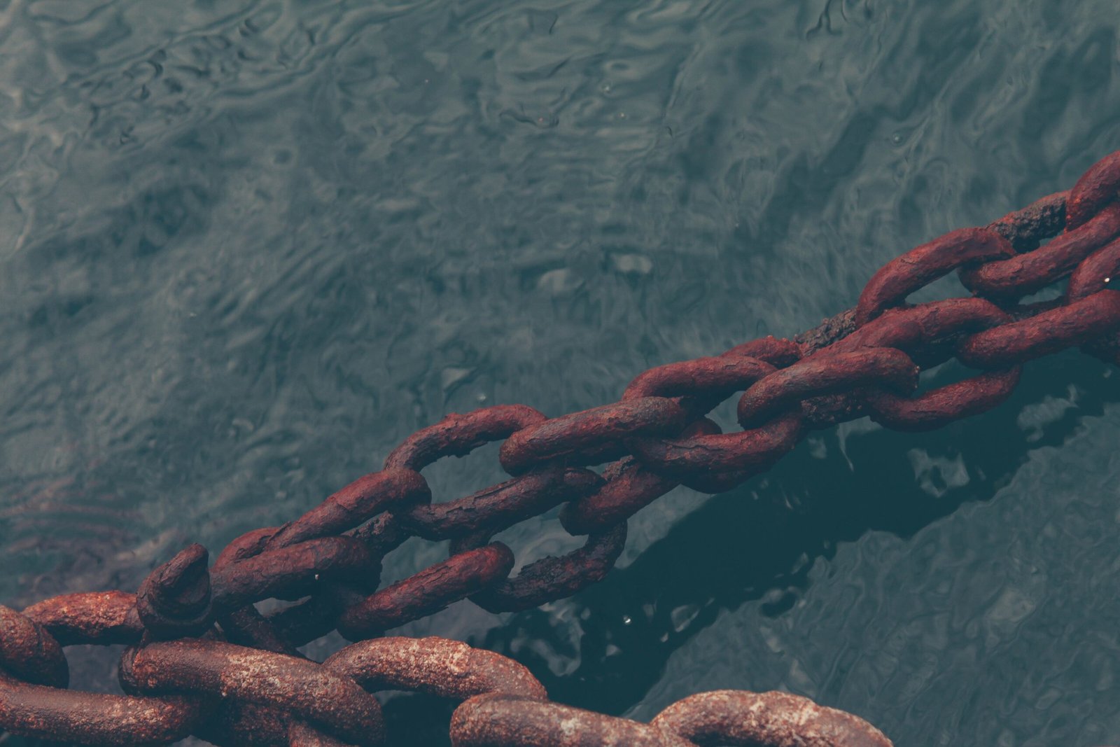 rusty chain on water
